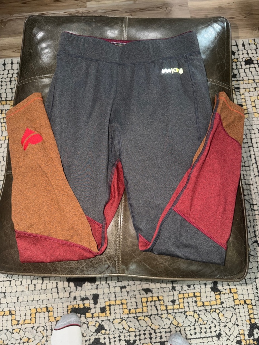 Run for Nepal Colorblock Leggings in Charcoal with Red and Brown Panels